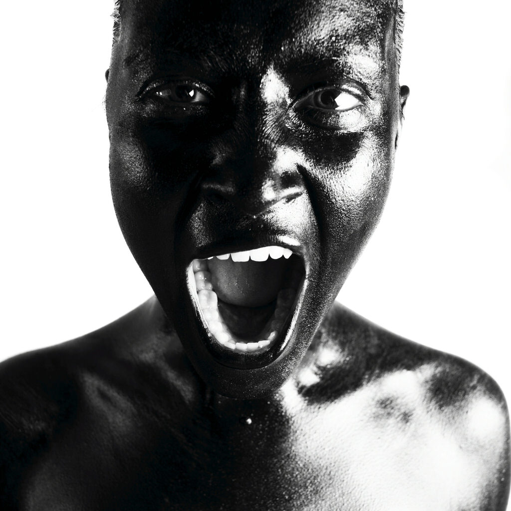 Black woman shouting. Studio photography.