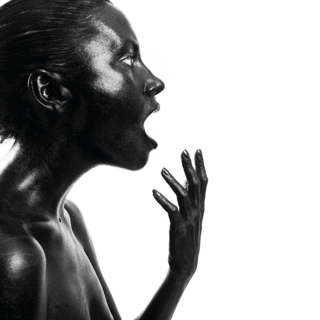 Black woman shouting. Studio photography.